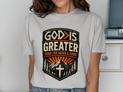 "God is greater than the highs and lows" t-shirt design with mountains.