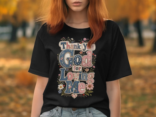 Black t-shirt with "Thank You God For Loving Me" text and floral accents.