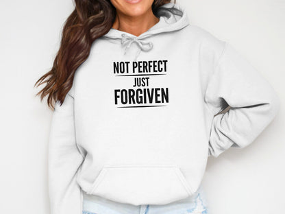 White hoodie with black text "NOT PERFECT JUST FORGIVEN".