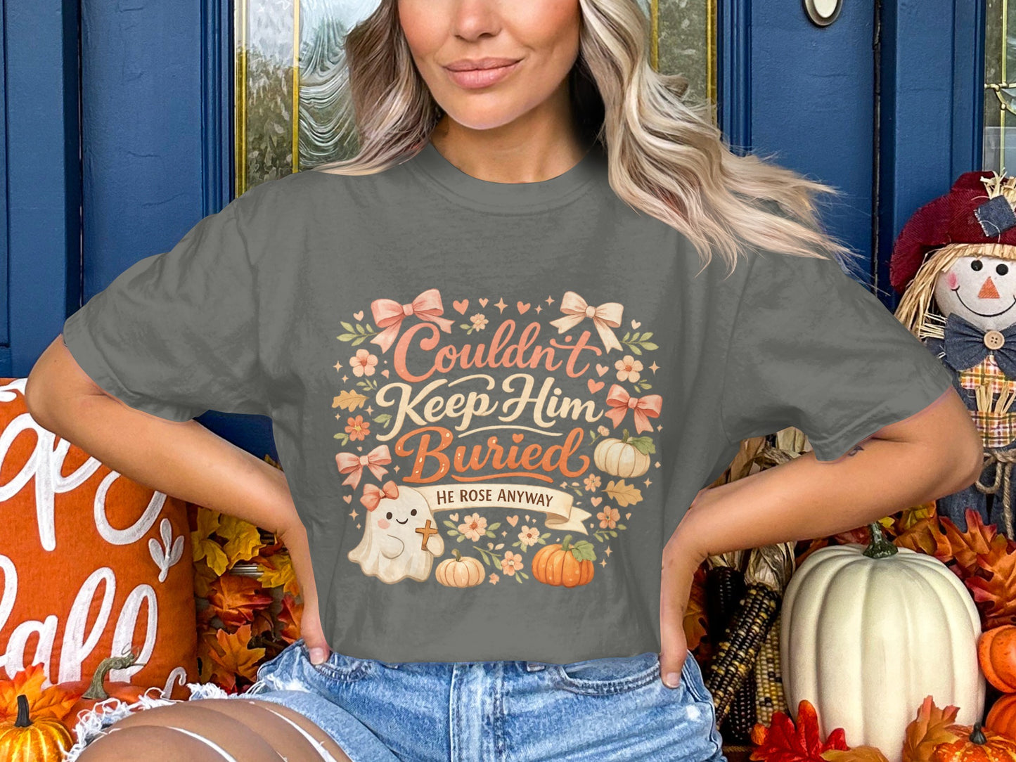 Gray t-shirt with "Couldn't Keep Him Buried, He Rose Anyway" and ghost.