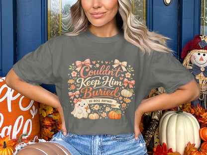 Gray t-shirt with "Couldn't Keep Him Buried, He Rose Anyway" and ghost.