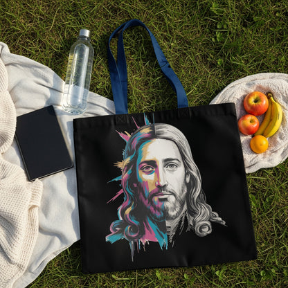 Black tote bag with a colorful, stylized portrait of Jesus.