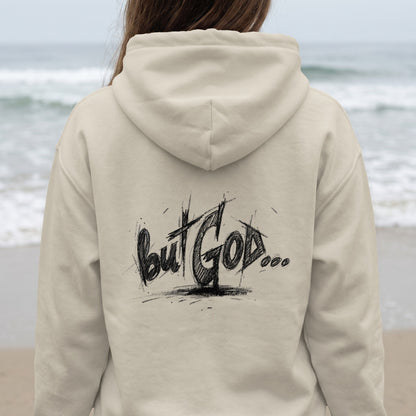 Back of beige hoodie with "But God..." scribbled text.