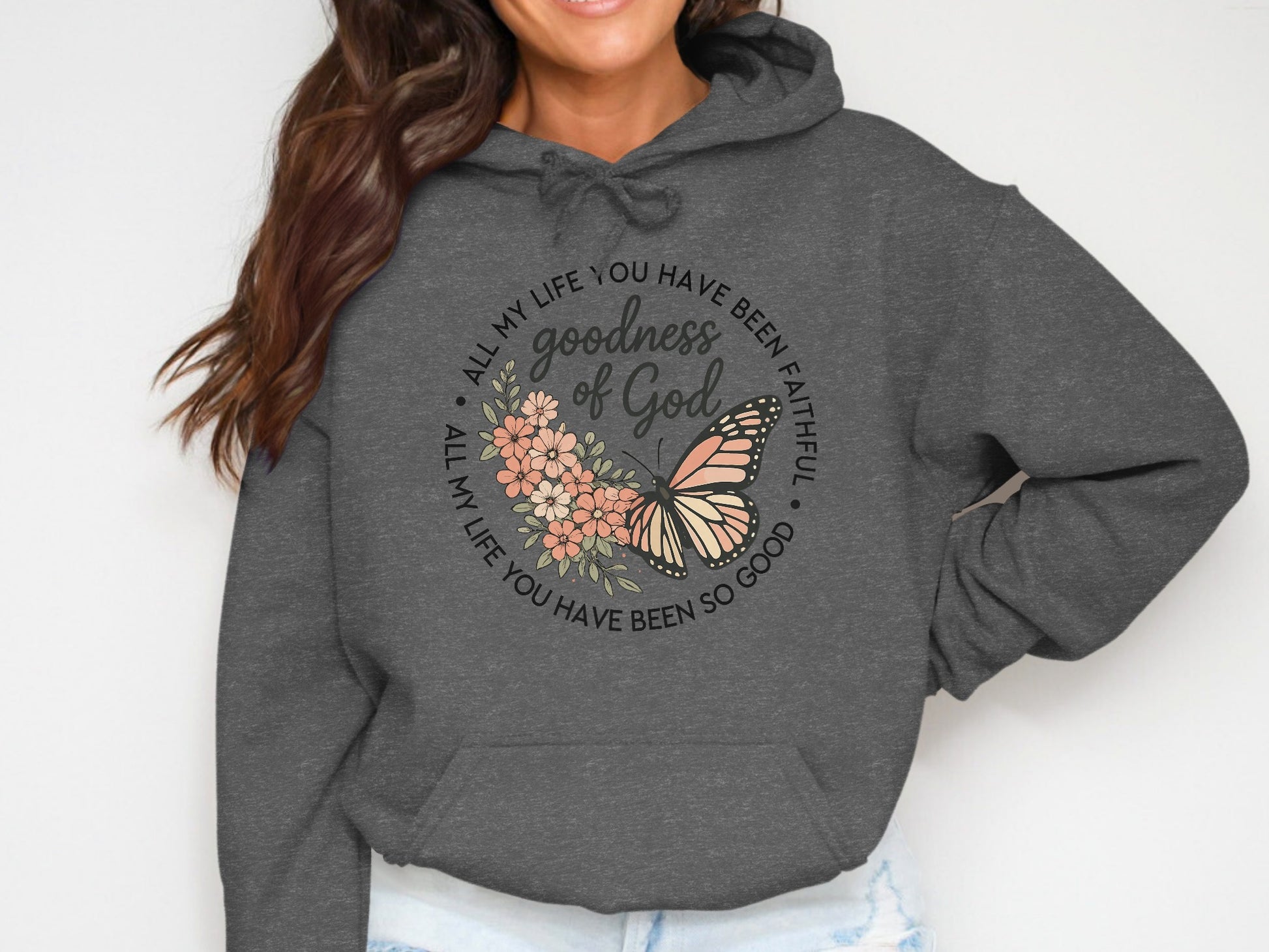 Dark gray hoodie with "All my life you have been faithful, goodness of God" text and butterfly.