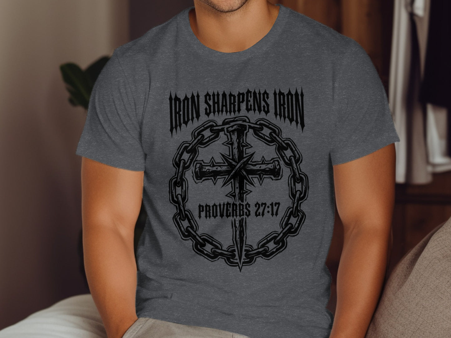 Dark gray t-shirt with "Iron Sharpens Iron Proverbs 27:17" and cross design.