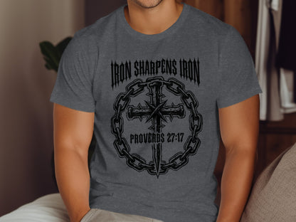 Dark gray t-shirt with "Iron Sharpens Iron Proverbs 27:17" and cross design.