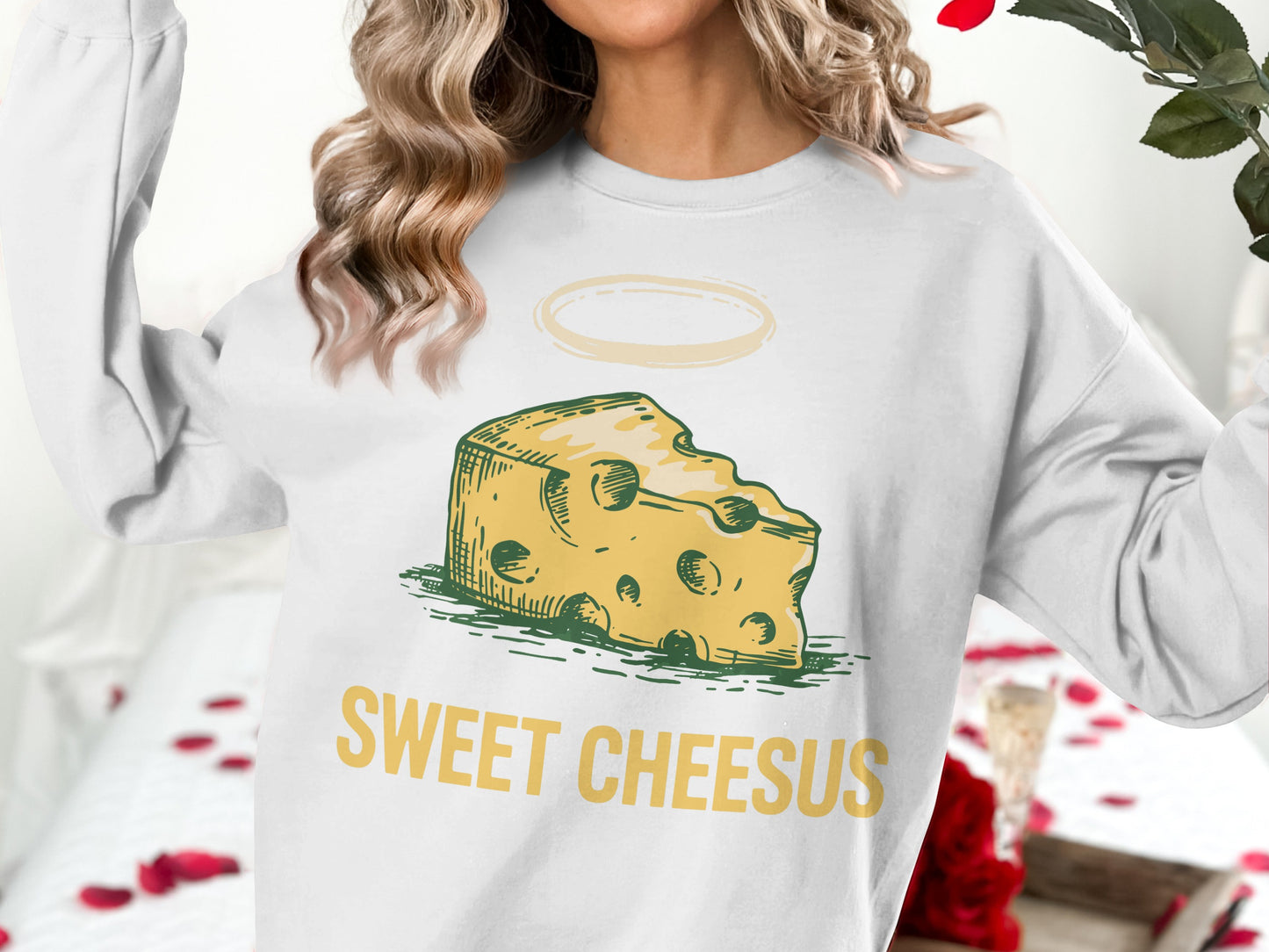 Sweatshirt with "SWEET CHEESUS" text and a slice of cheese with a halo.