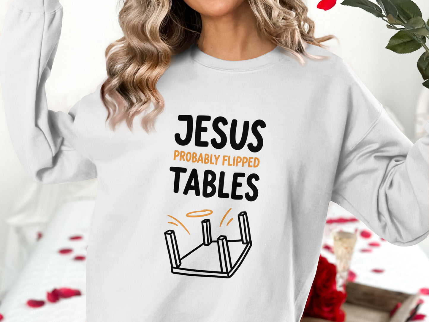 White sweatshirt with "JESUS PROBABLY FLIPPED TABLES" and overturned table graphic.