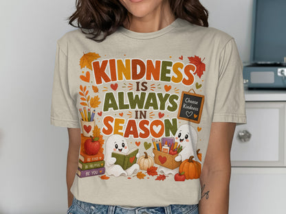 T-shirt graphic: "Kindness is Always in Season" with cute ghosts, books, and fall leaves.