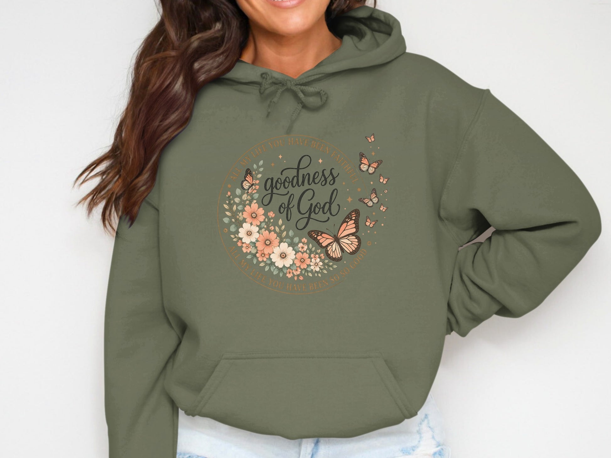 Hoodie with floral wreath, butterflies, and "goodness of God" text.