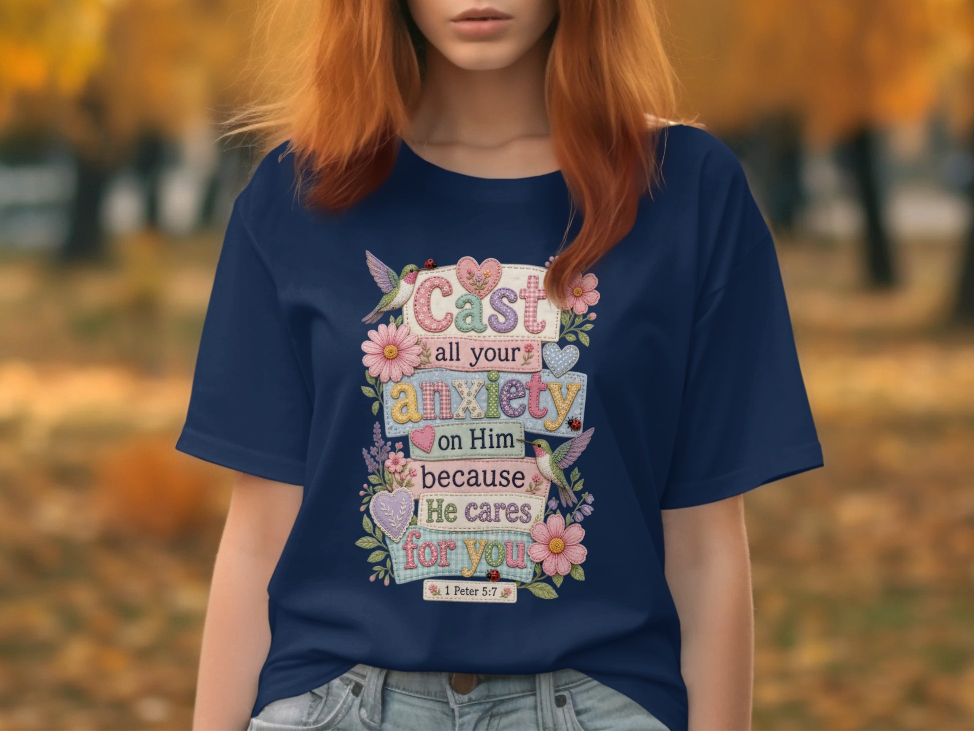 Navy t-shirt with text "Cast all your anxiety on Him because He cares for you 1 Peter 5:7".