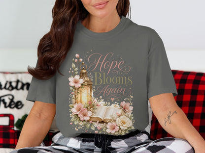 T-shirt with floral design, lantern, and text "Hope Blooms Again".
