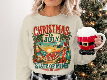 Crewneck sweatshirt with "Christmas in July" graphic featuring beach scene and Santa mug.