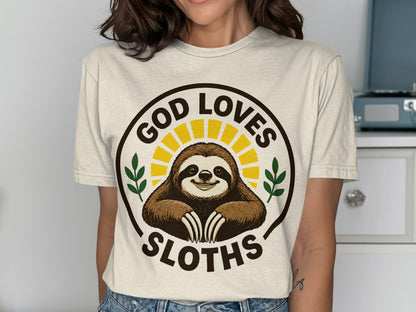 T-shirt with a smiling sloth in a sunburst circle, saying "God Loves Sloths".