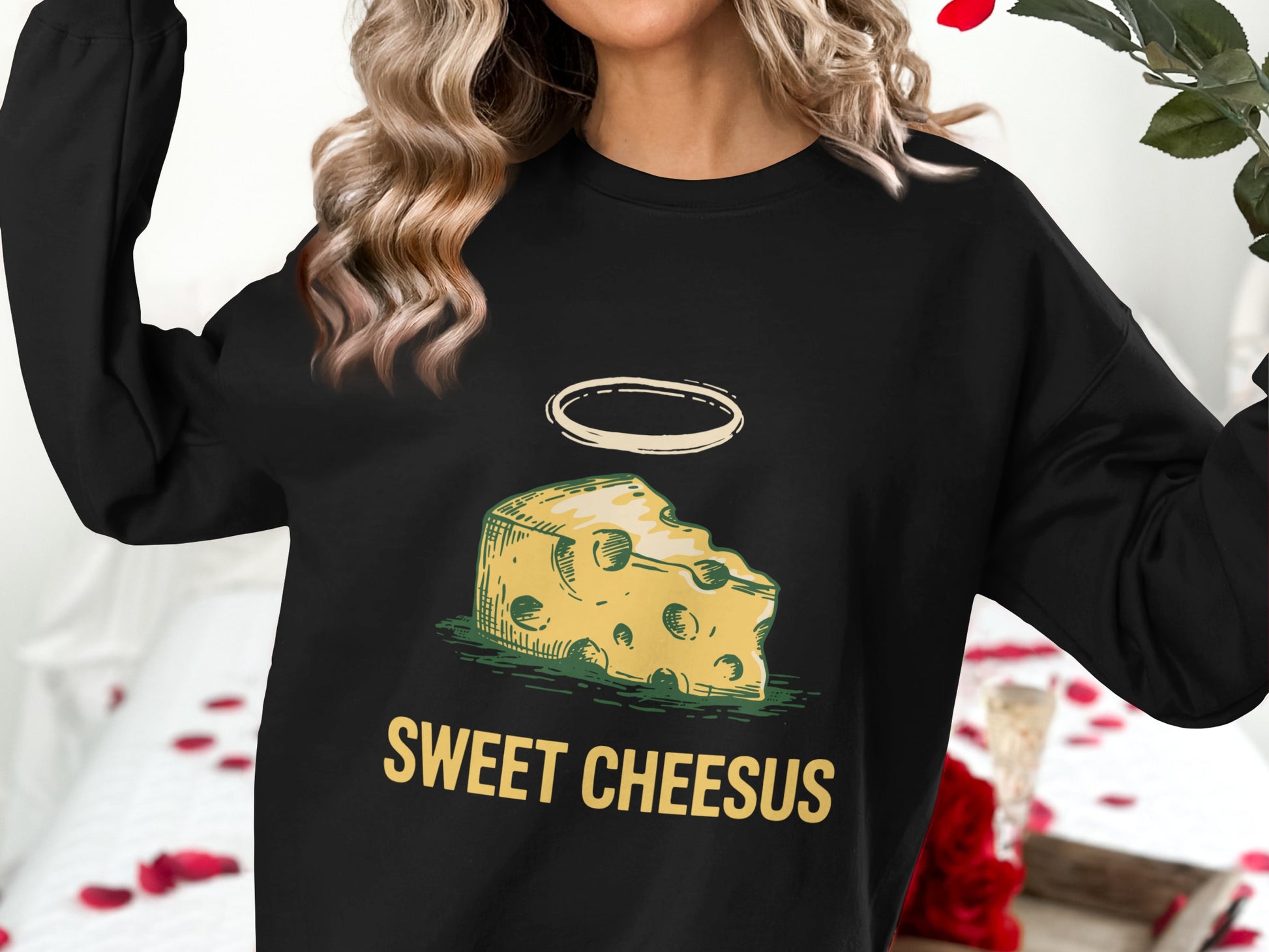 Black sweatshirt with "Sweet Cheesus" text and cheese illustration.