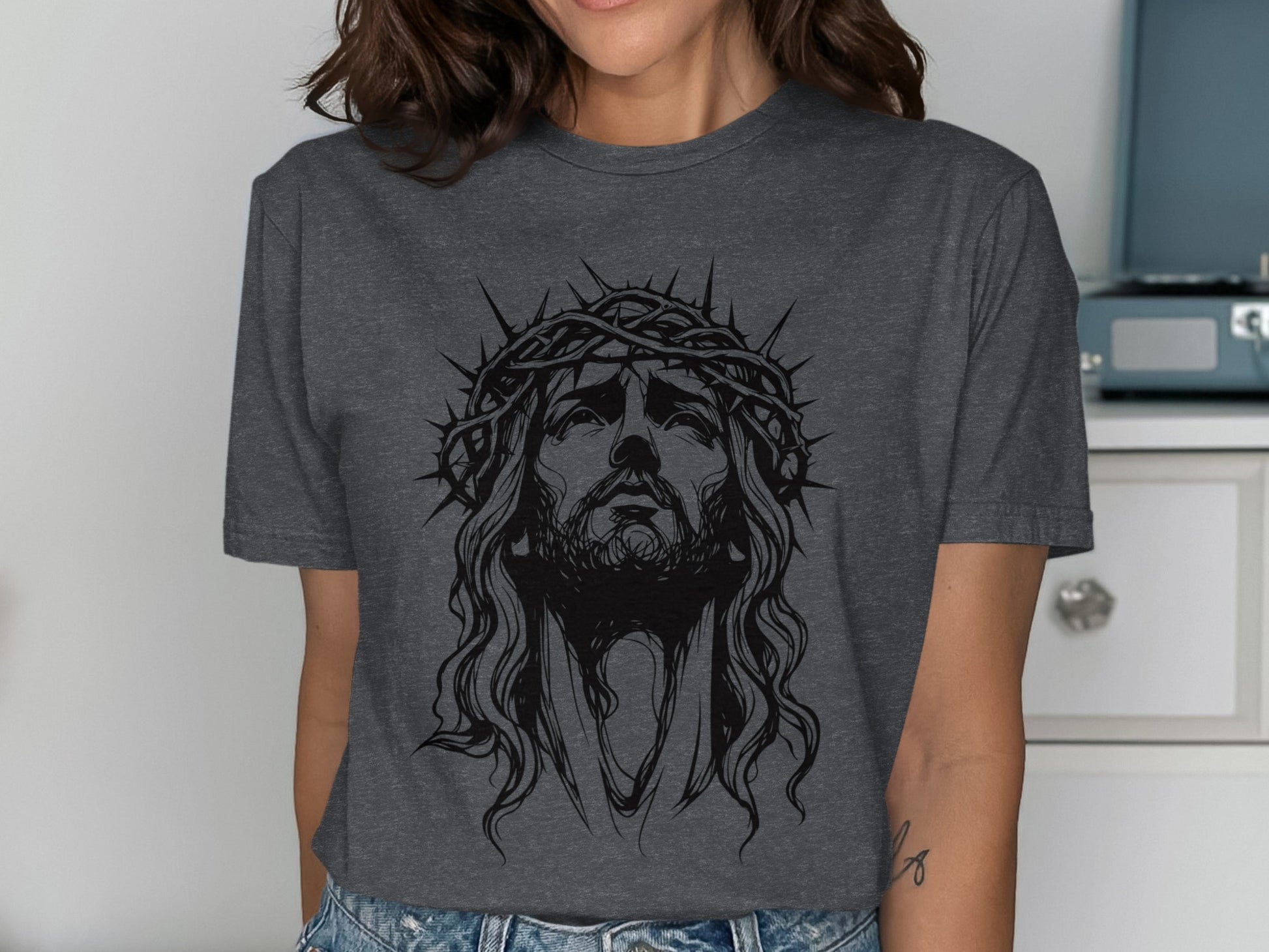 Charcoal t-shirt with a line drawing of Jesus wearing a crown of thorns.