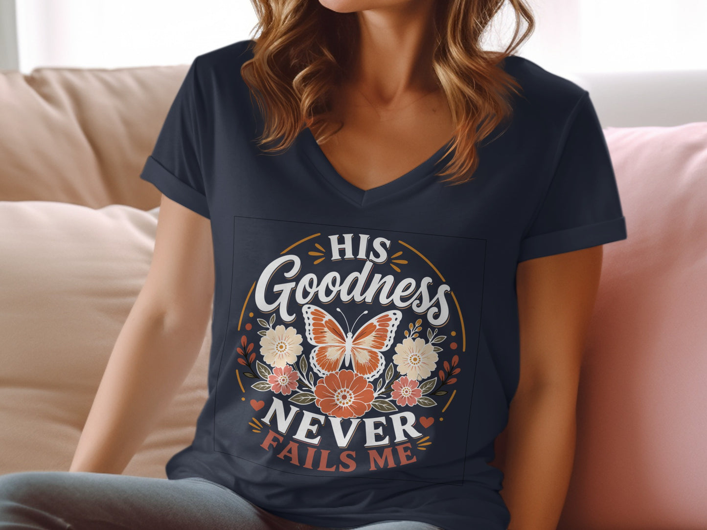 Navy v-neck t-shirt with "His Goodness Never Fails Me" floral butterfly design.