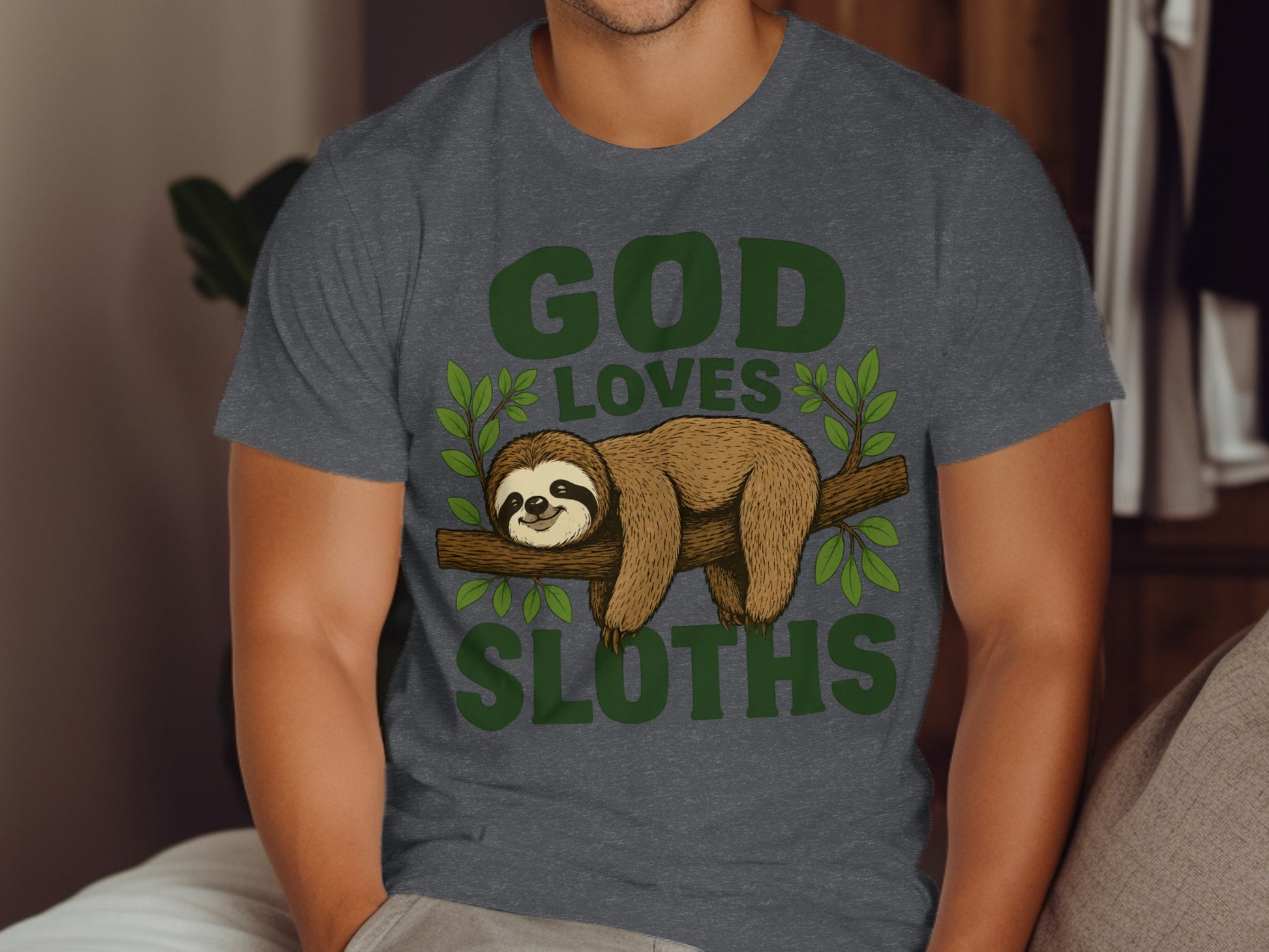 Dark gray t-shirt with a sloth on a branch, reading "GOD LOVES SLOTHS".