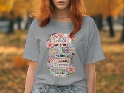 Gray t-shirt with "Cast all your anxiety on Him because He cares for you" scripture.