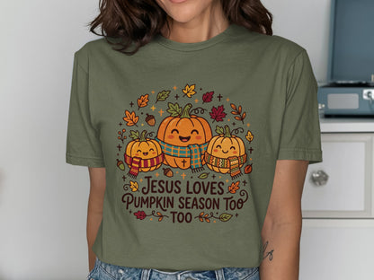 Three smiling pumpkins wearing scarves with "Jesus loves pumpkin season too" text.
