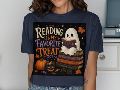 Ghost reading on books with text "Reading is my favorite treat" and Halloween elements.