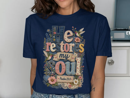 Navy t-shirt with "He restores my soul" and floral hummingbird design.