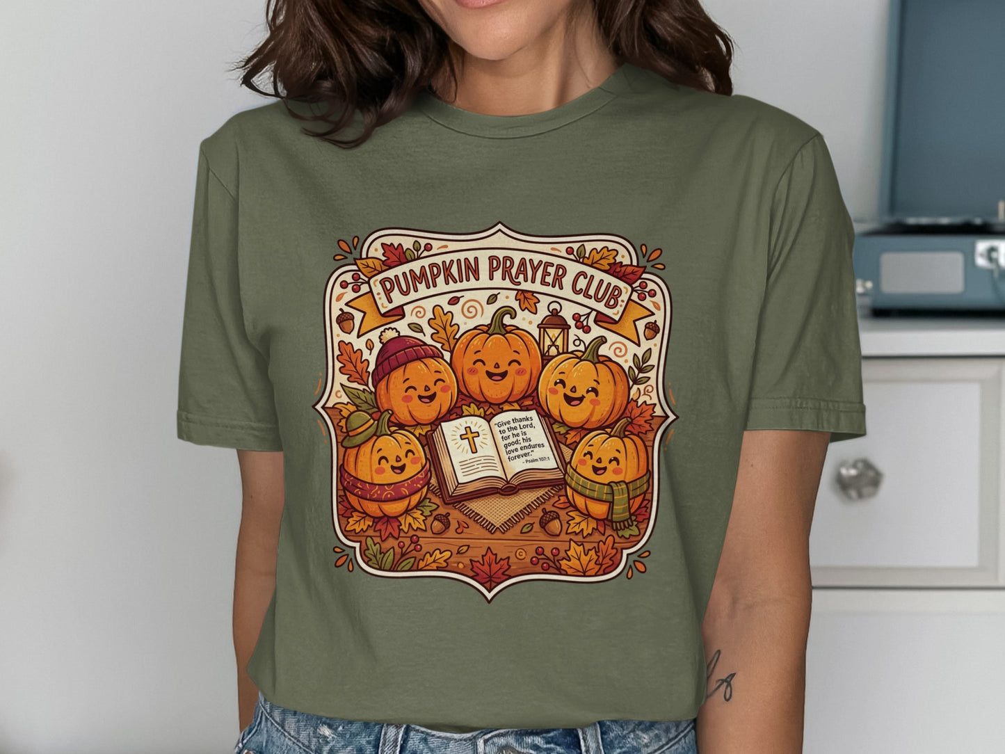 Pumpkin Prayer Club tee with smiling pumpkins reading Bible.