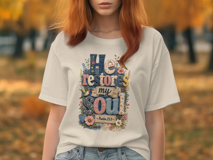White t-shirt with "He Restores My Soul" text and Psalm 23:3.