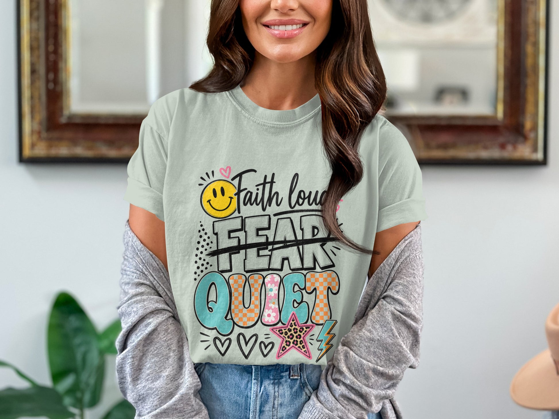 Light green t-shirt with "Faith over Fear" graphic.