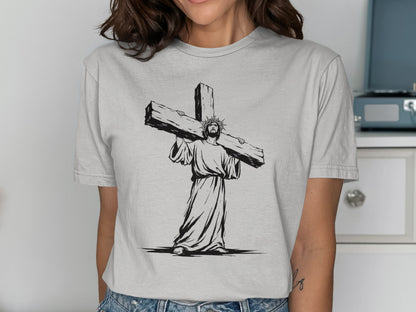 Jesus carrying a large cross, depicted in black and white sketch.