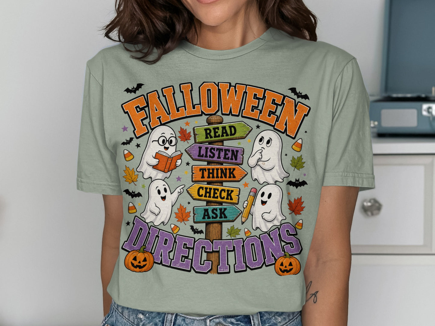 Halloween shirt with ghosts and directional signs saying READ, LISTEN, THINK, CHECK, ASK DIRECTIONS.