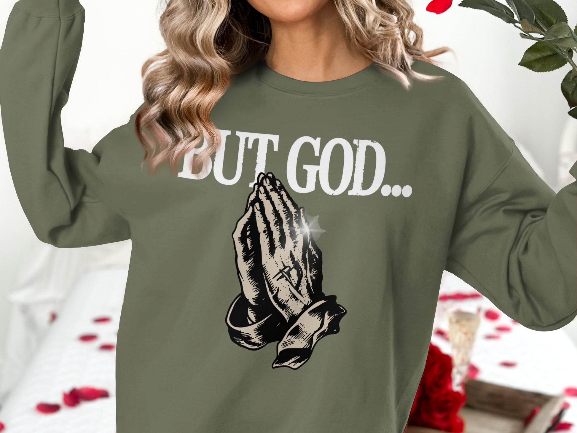 Olive green sweatshirt with praying hands and "BUT GOD..." text.