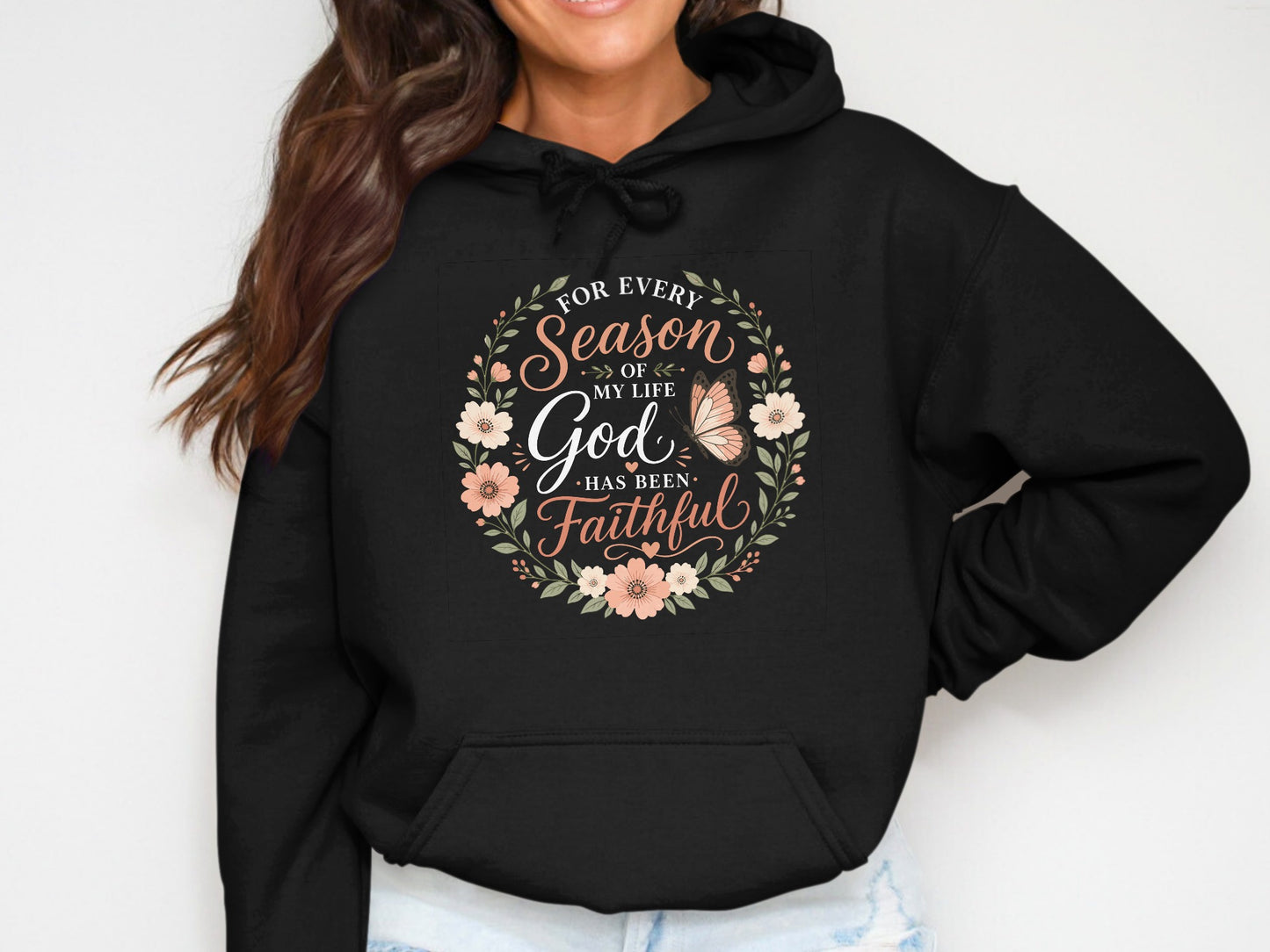 Black hoodie with floral wreath and "God Has Been Faithful" text.
