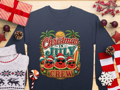 Christmas in July crew graphic on a navy sweatshirt with holiday decorations.
