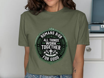 Green t-shirt with "Romans 8:28 All Things Work Together For Good" text.
