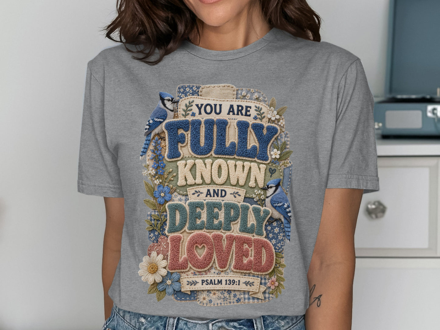 Gray t-shirt with "You are fully known and deeply loved Psalm 139:1" text and bluebirds.