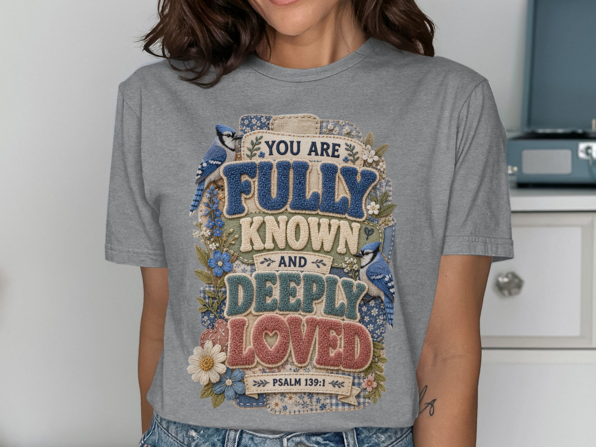 Gray t-shirt with "You are fully known and deeply loved Psalm 139:1" text and bluebirds.