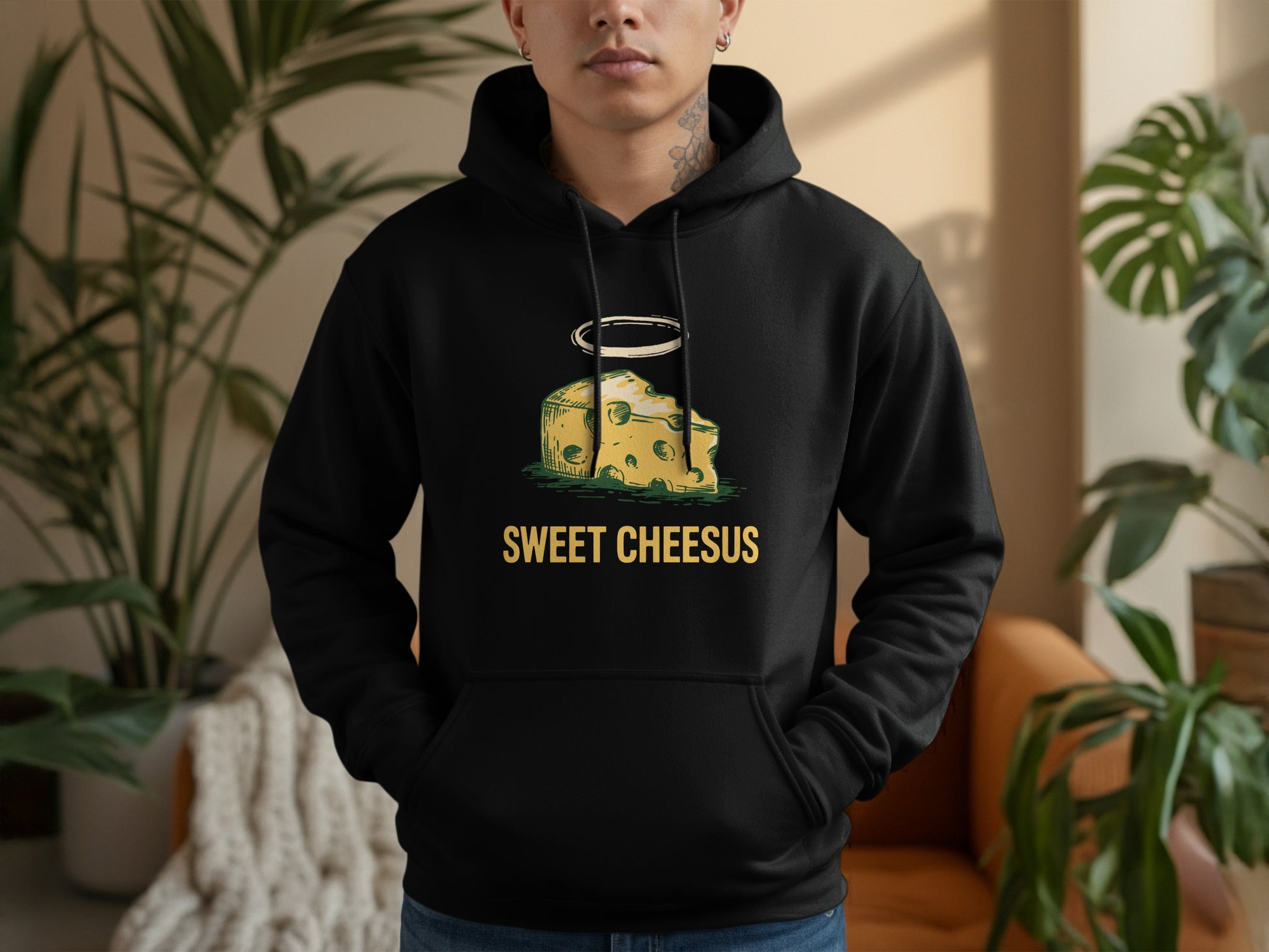 Black hoodie with a humorous cheese graphic and text "SWEET CHEESUS".