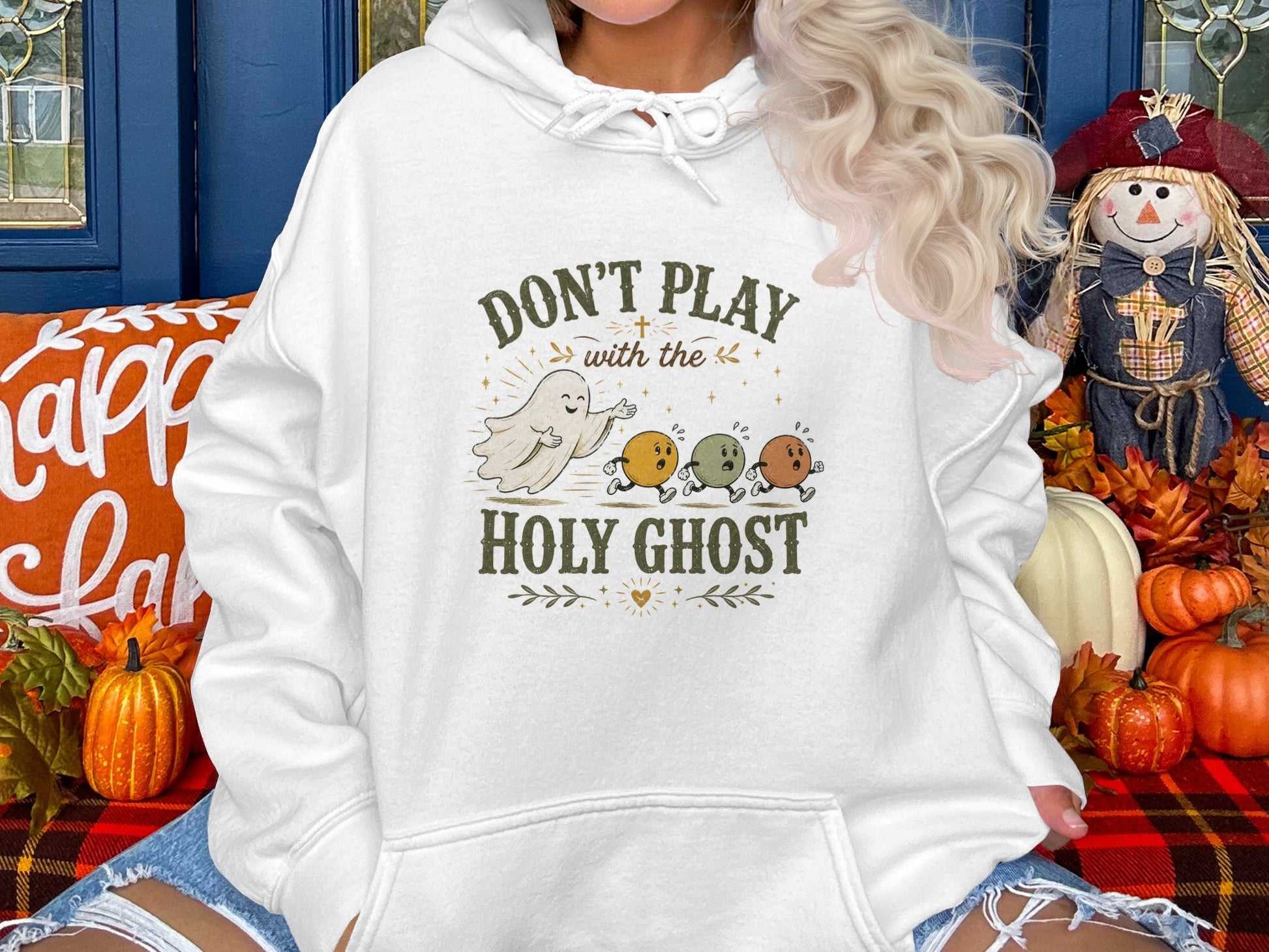 White hoodie with "Don't Play with the Holy Ghost" and ghost graphic.