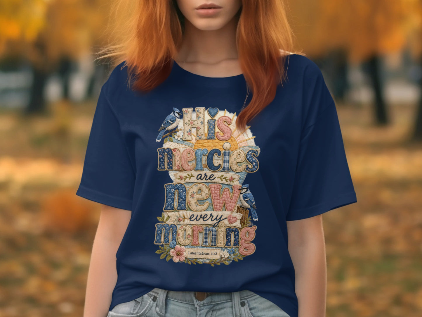 Navy t-shirt with "HIS mercies are new every morning" text and floral accents.