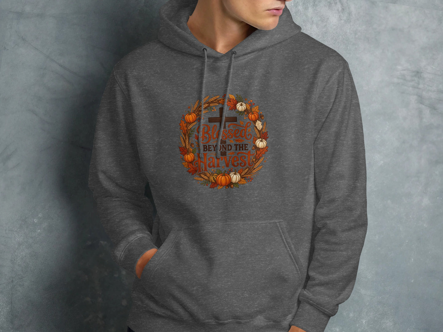 Gray hoodie with "Blessed Beyond the Harvest" text and autumn wreath graphic.