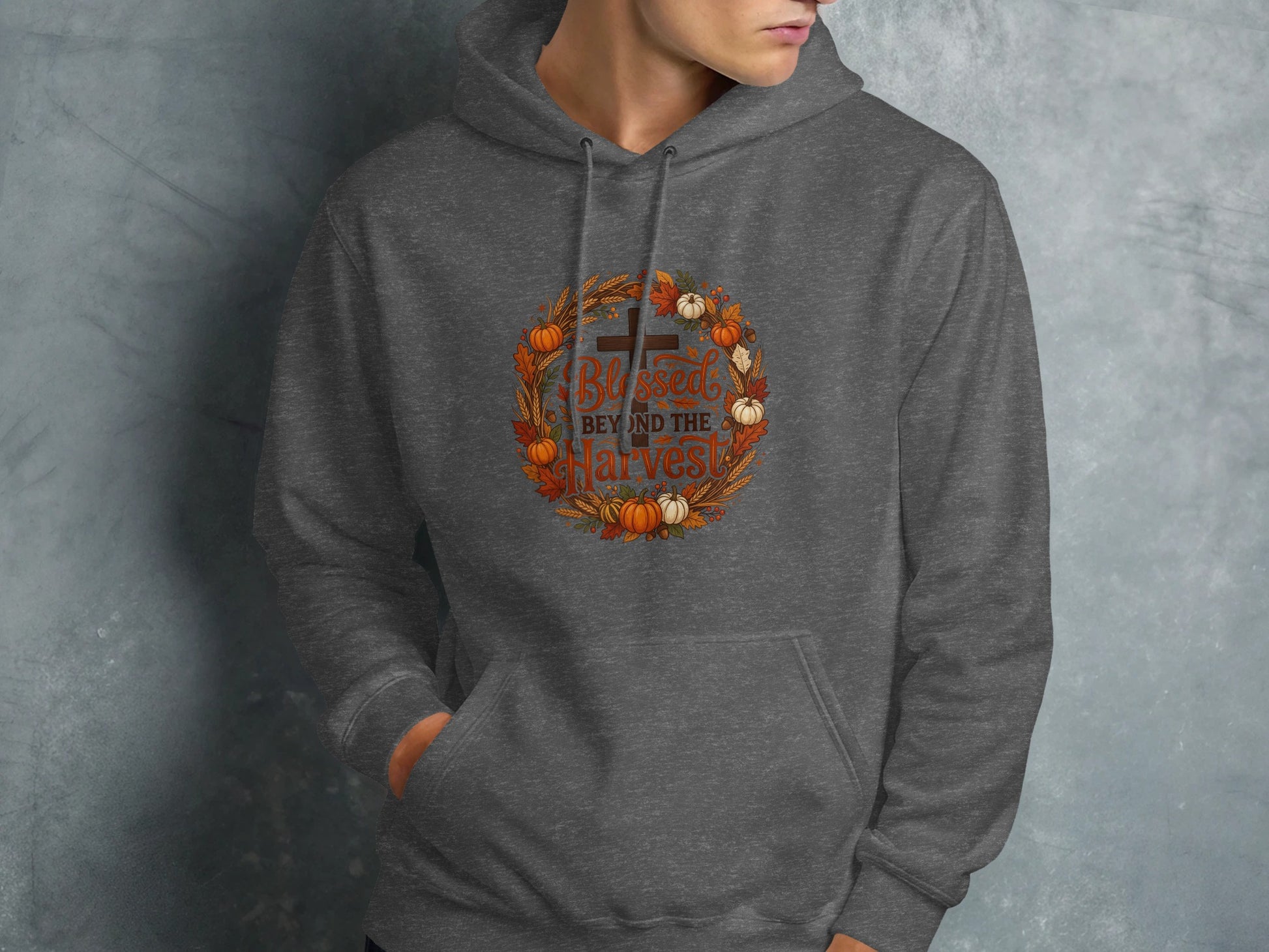 Gray hoodie with "Blessed Beyond the Harvest" text and autumn wreath graphic.