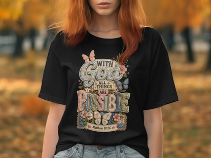Black t-shirt with "All things are possible" text, butterflies, and flowers.