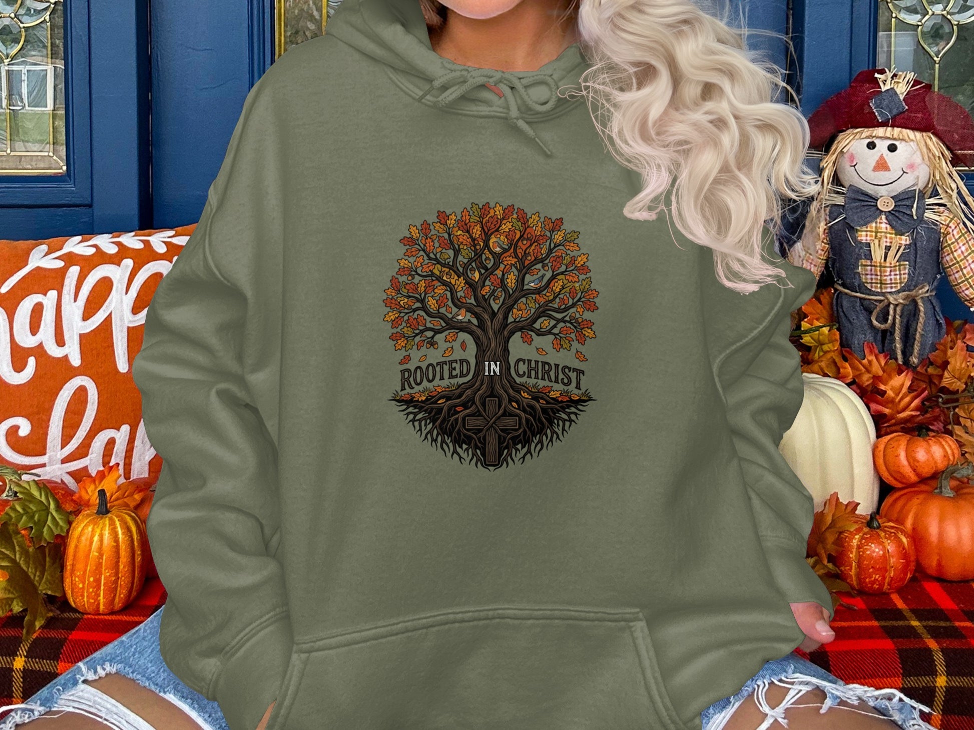 Olive green hoodie with a tree of life and "Rooted in Christ" text.