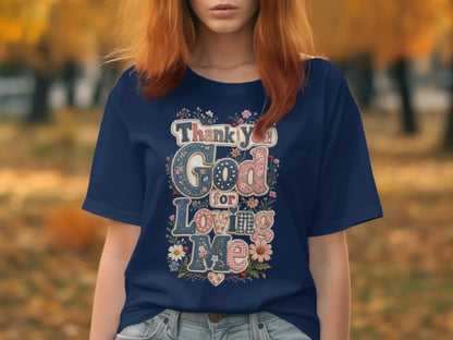 Navy t-shirt with "Thank You God For Loving Me" text design.