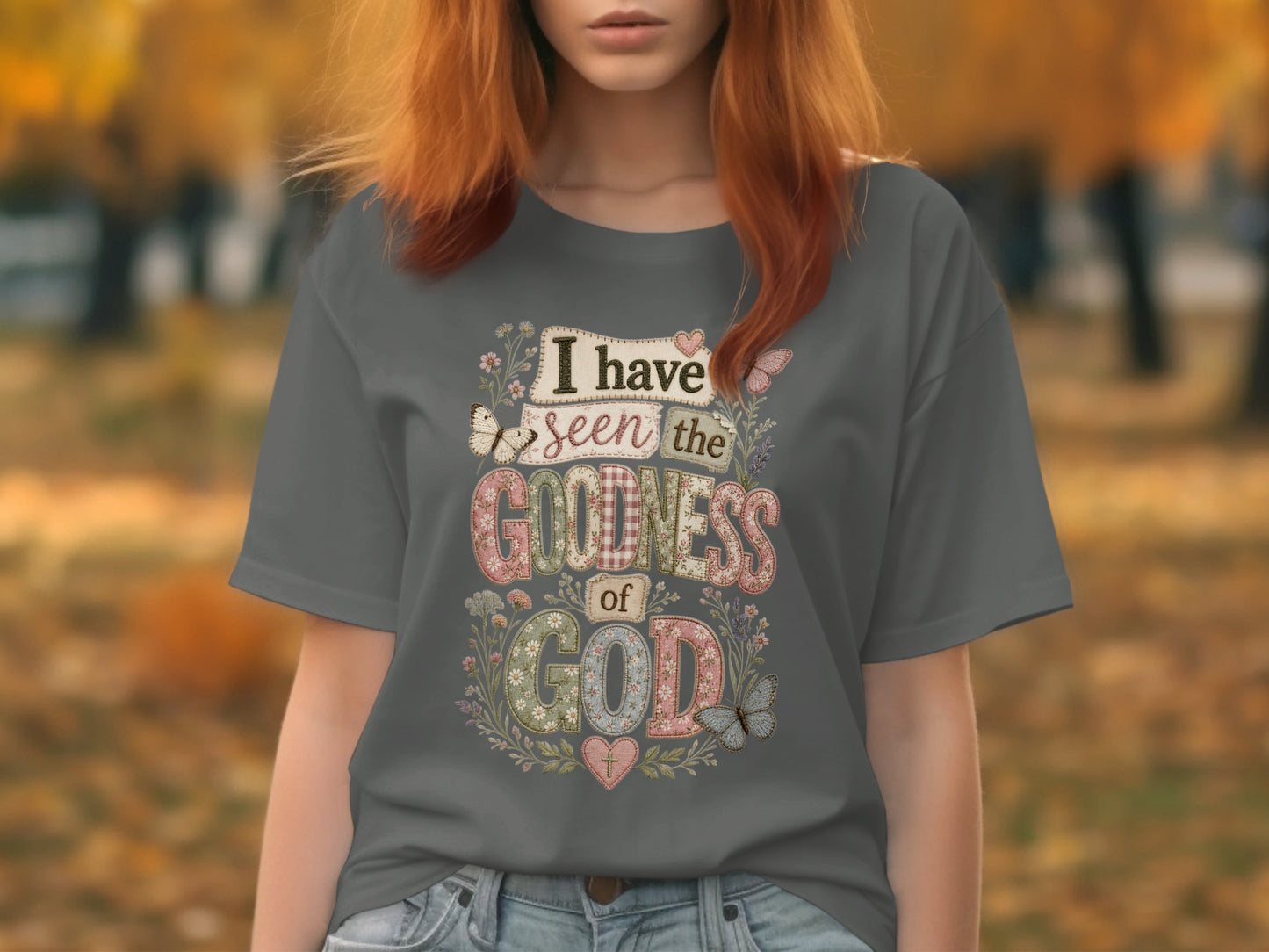 Grey t-shirt with "I have seen the goodness of God" text and floral accents.