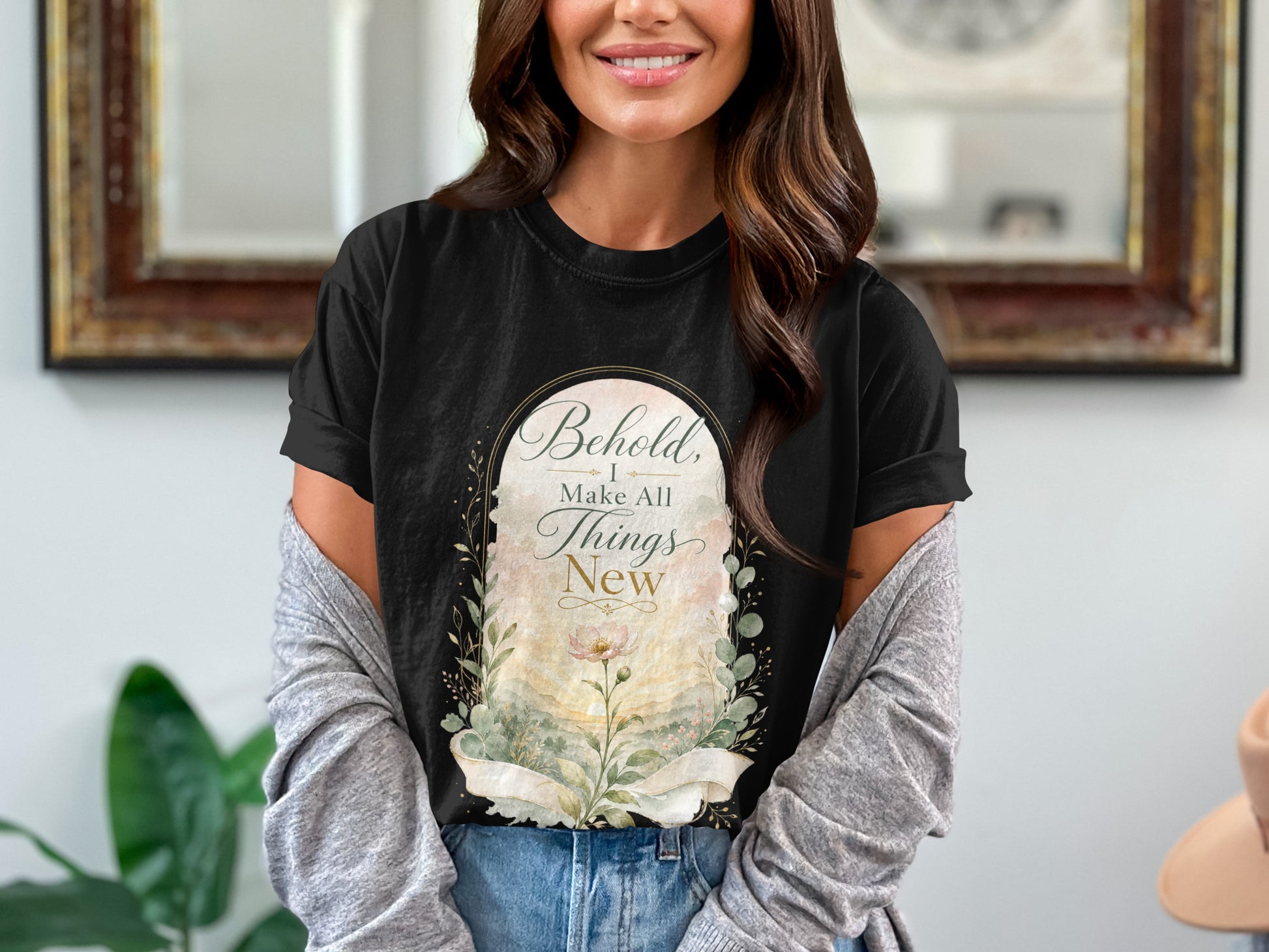 Black t-shirt with "Behold, I Make All Things New" text art and floral design.