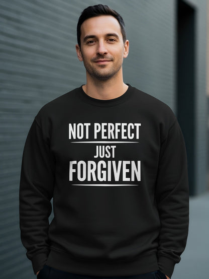 Black sweatshirt with white text "NOT PERFECT JUST FORGIVEN" worn by a man.