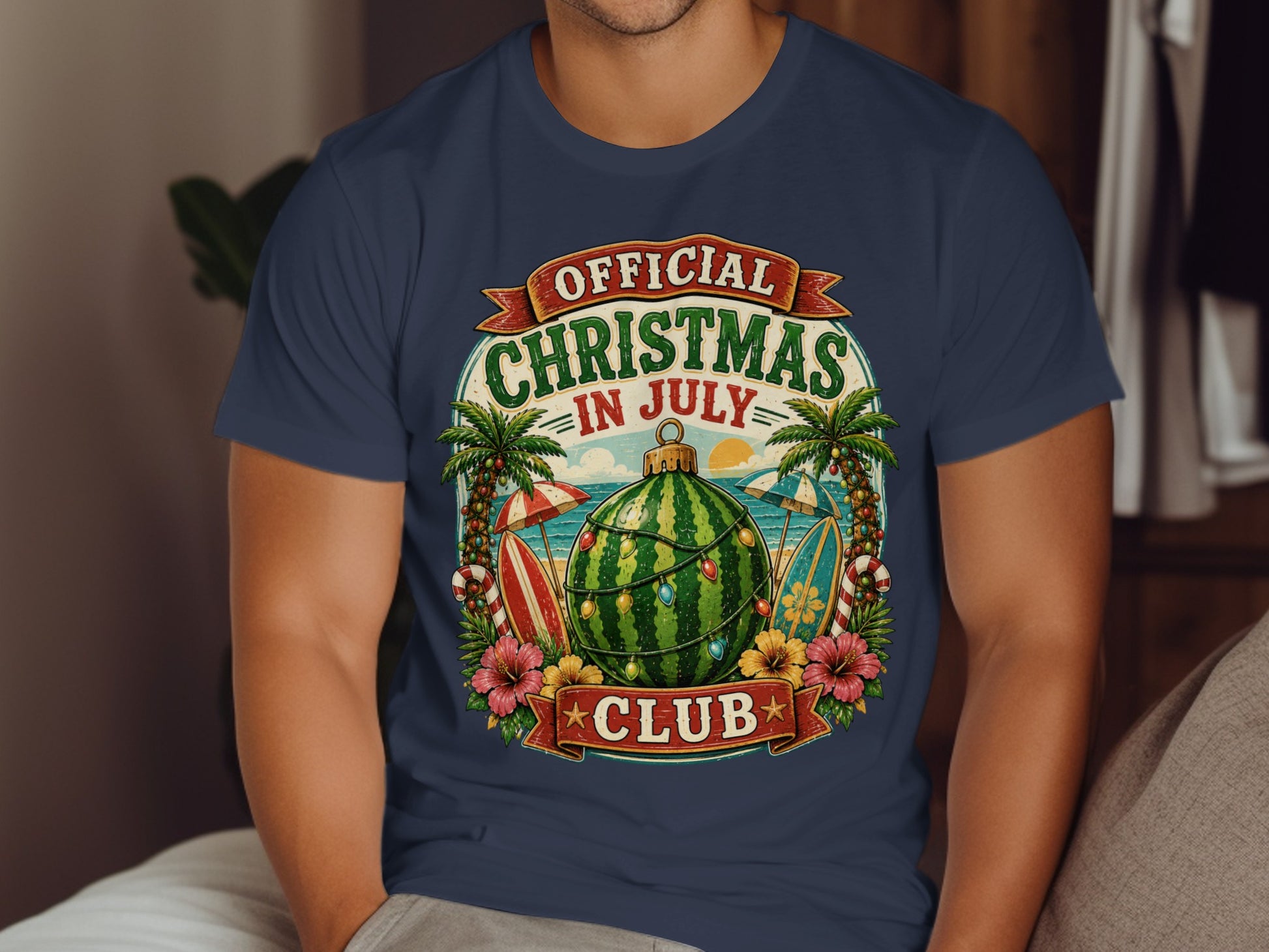 Navy t-shirt with "Official Christmas in July Club" text and tropical Christmas design.