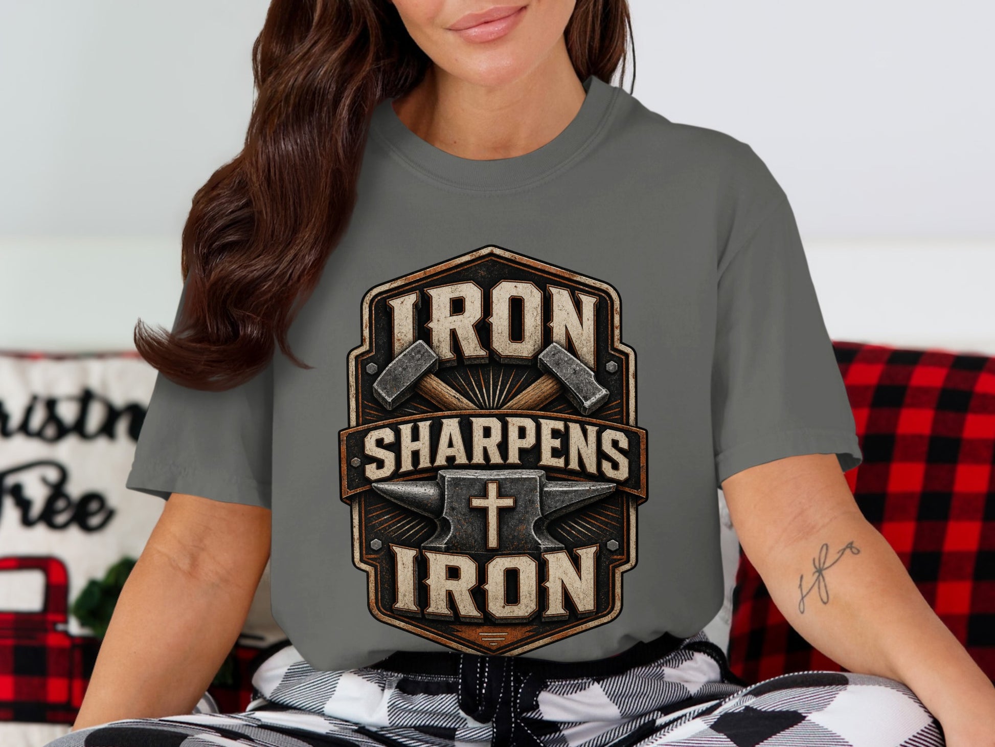 Grey t-shirt with "IRON SHARPENS IRON" text, anvil, hammers, and Christian cross graphic.